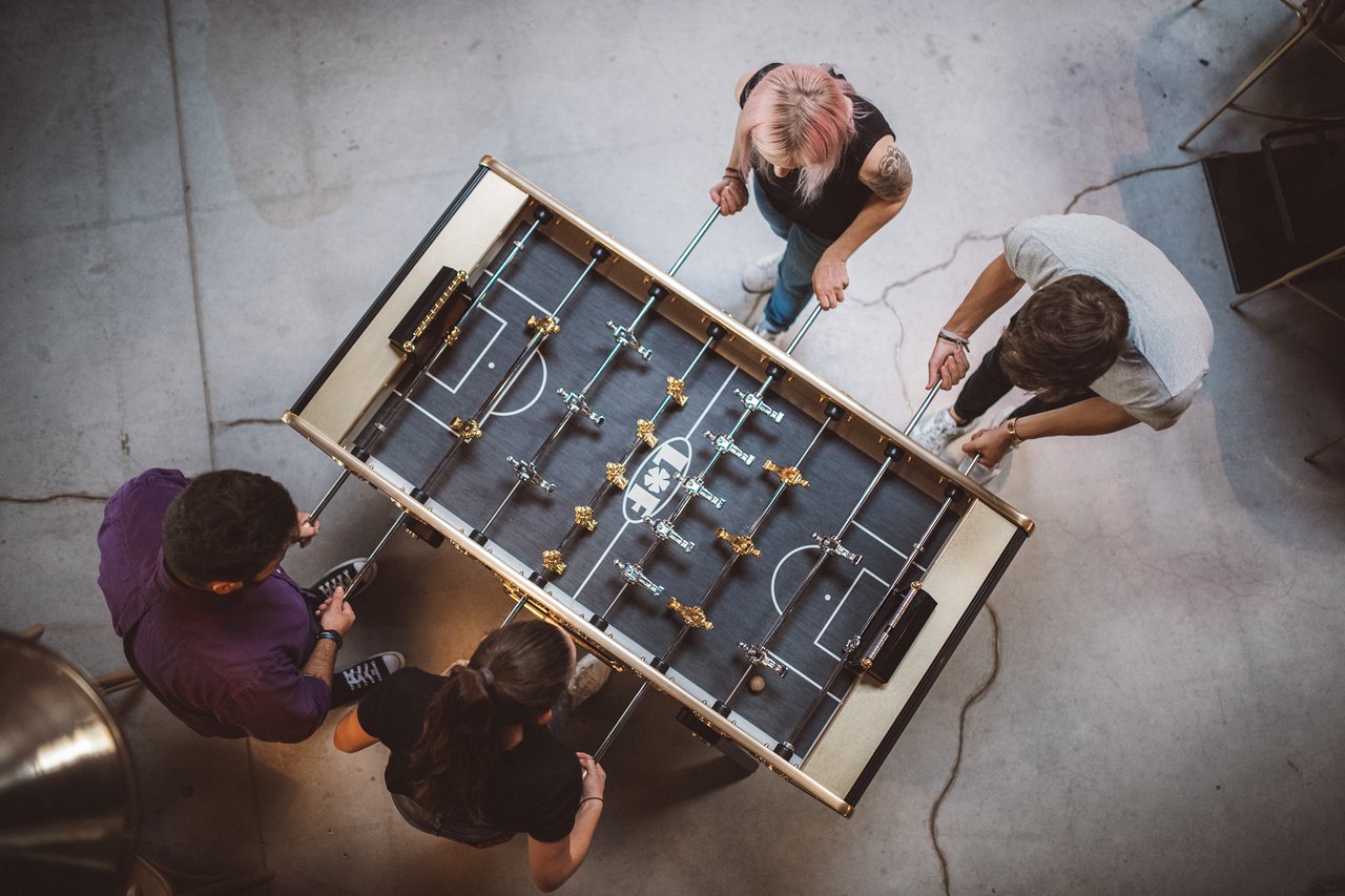 Top view of the Stella Champion Gold foosball table showcasing its luxurious gold-plated finish and detailed playing field