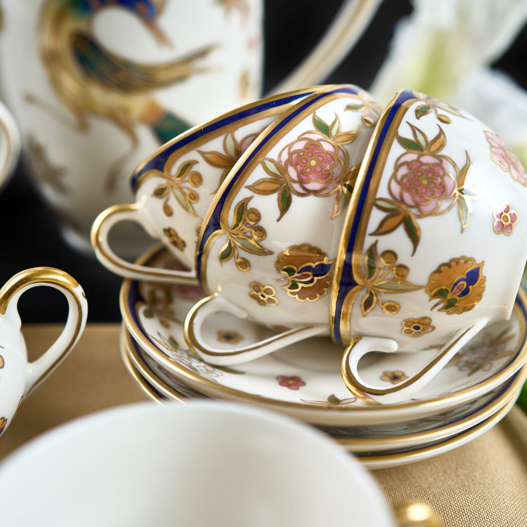 Tea cup and saucer with gold and blue rim | Phoenix